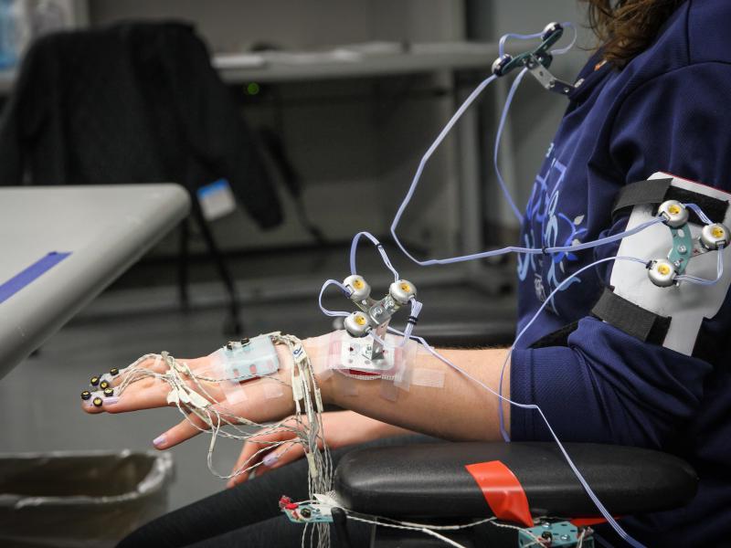 A participant undergoes advanced biomechanical testing in Kettering University's Human Interfaces Ergonomics Laboratory, utilizing sensors to analyze motion and muscle activity.